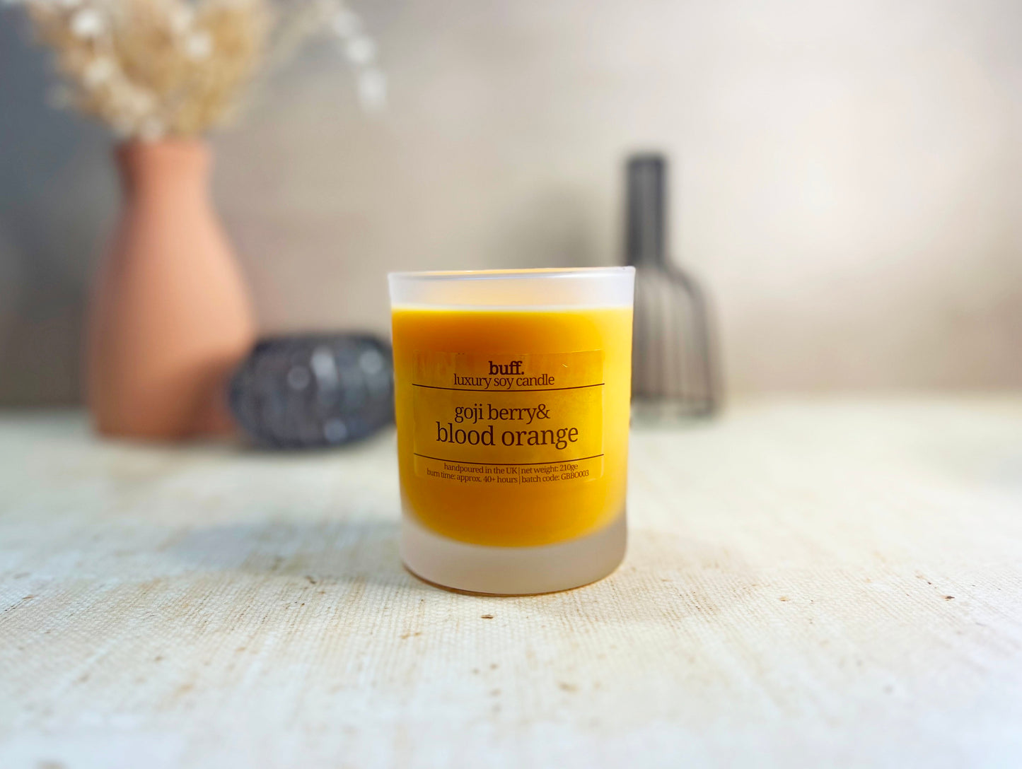 Orange soy wax candle in frosted glass